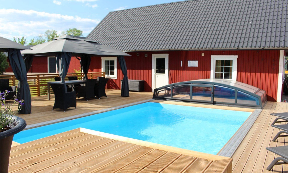 Vackelsang House | Large comfortable vacation home with private pool, motorboat and lake view