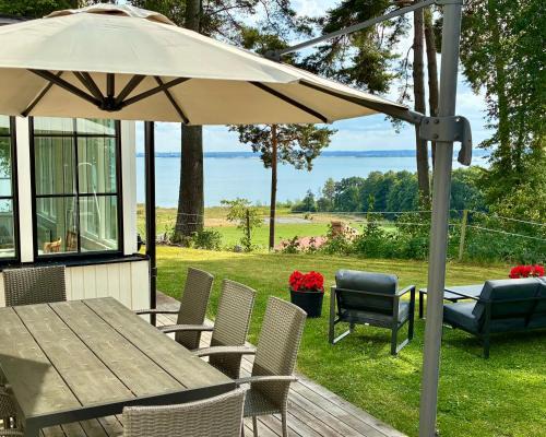 Vreta Kloster House | Manor wing with scenic lake view
