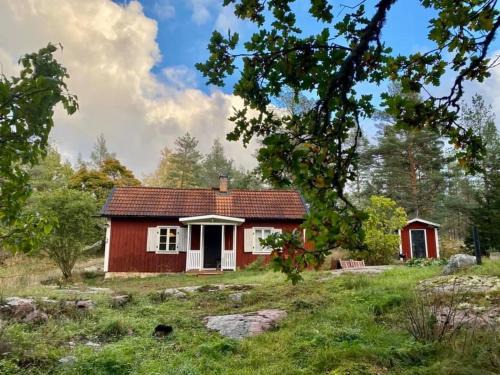 Figeholm House | Our classic red cottage in the woods