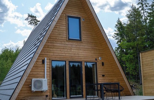 Tvetaryd House | A Frame cottage surrounded by a forest, incl sauna