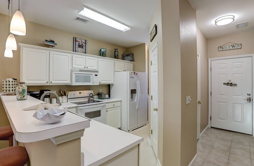 Sunset Beach Condo | Coral Hideaway: Balcony | Pool | Dog Friendly