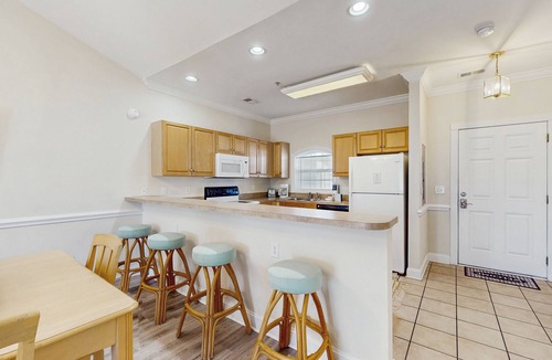 Central Myrtle Beach Condo | Golf course view condo with private balcony, W/D, pool & close to beach