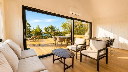 Stromstad House | Modern Scandinavian cabin by the sea, calm, private setting, 50m to ocean