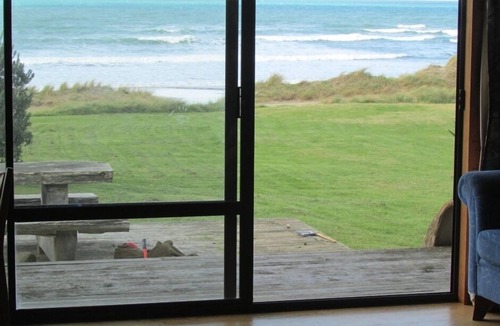 Mataikona House | Ocean-front beach house with warm outside shower.