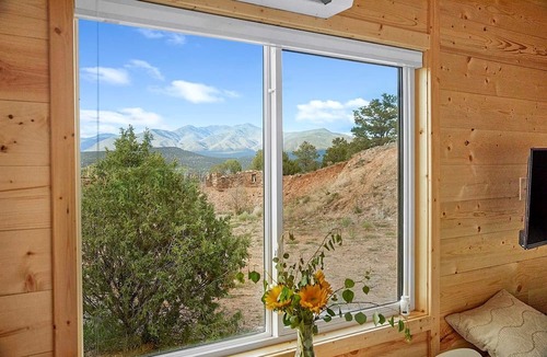 Arroyo Hondo Cabin | Rainbow Tiny Home with View & Hot Tub near Hot Springs, El Prado, NM