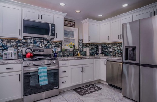 McHenry House | Waterfront Vacation Rental on Fox River | Walk to Downtown McHenry | 3BR/2BA Home with Private Pier
