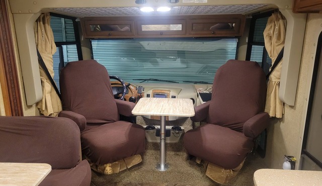 Class A motorhome. In our backyard or a local RV resort.