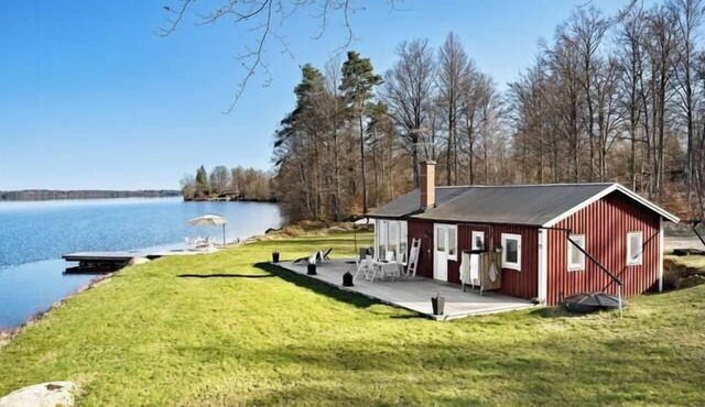 Cottage with beach plot, boat and jetty in Småland