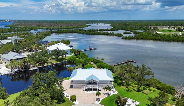 Experience luxury at The Lookout, a 3-bedroom home in scenic Placida, FL with ocean views.
