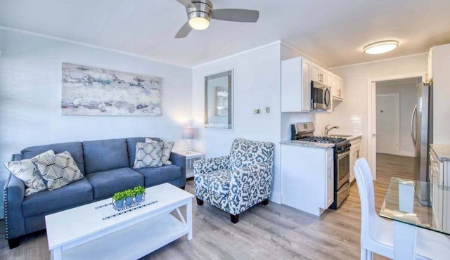 Lakefront corner condo with canoes, resort pool, tennis & firepit - dogs welcome