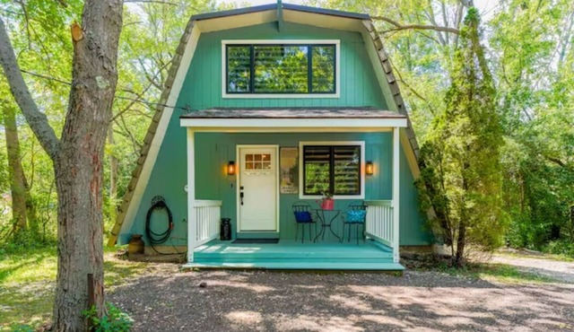 Rustic Riverside A-Frame Retreat: Secluded Charm.