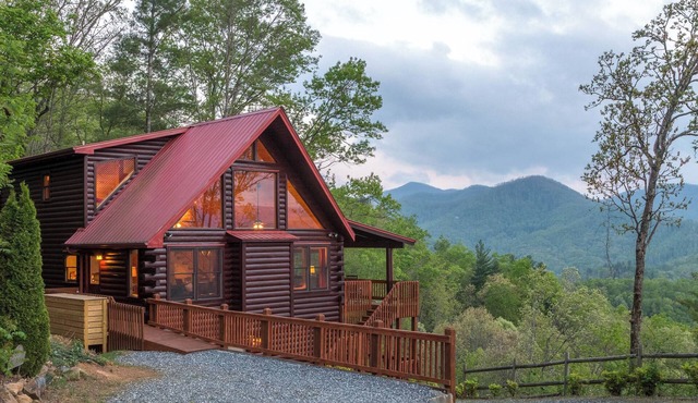 Spacious log cabin with spectacular mountain views - private hot tub & sauna