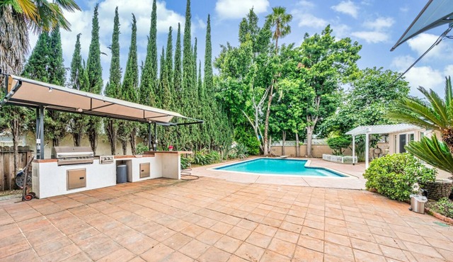 studio with pool and bbq grill